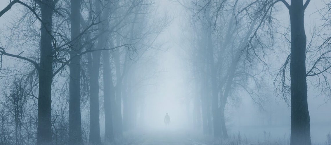 Silhouette,Of,A,Lonely,Man,Standing,On,The,Foggy,Road