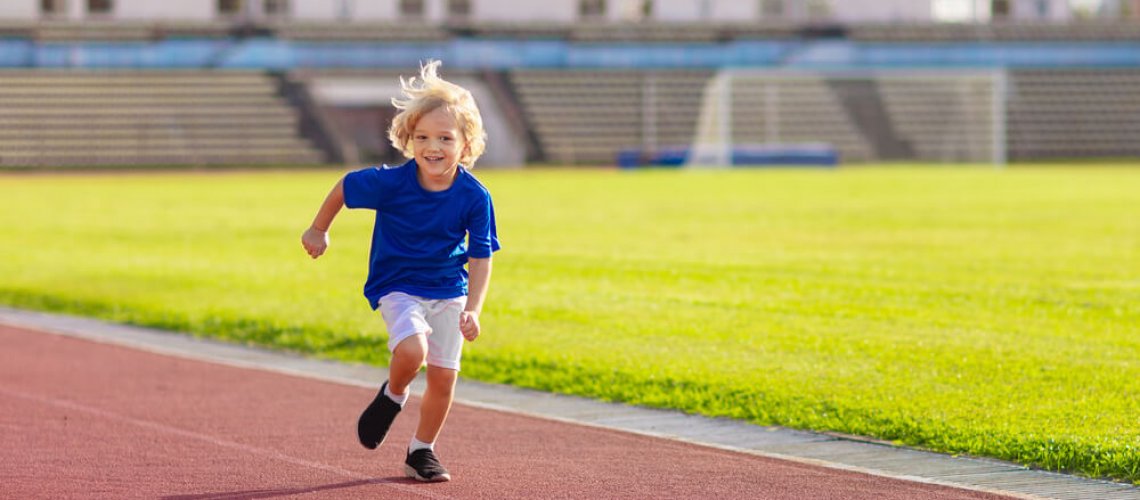 Child,Running,In,Stadium.,Kids,Run,On,Outdoor,Track.,Healthy